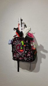 "Back Packin" 16” x 23” found objects, toy guns, back pack 